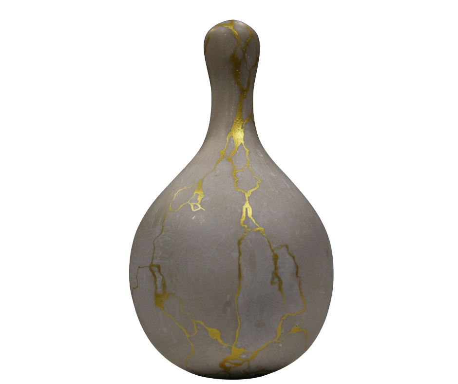 Kintsugi vase — broken and restored with gold